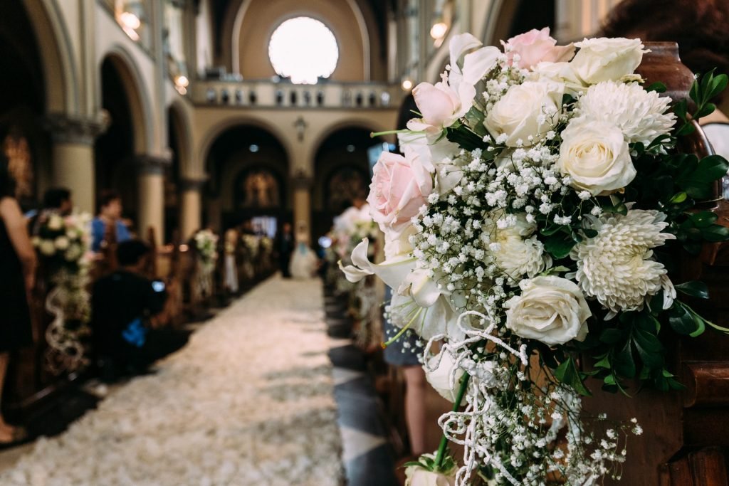 Beautiful flower bouquet decoration for wedding in a church with blur background.